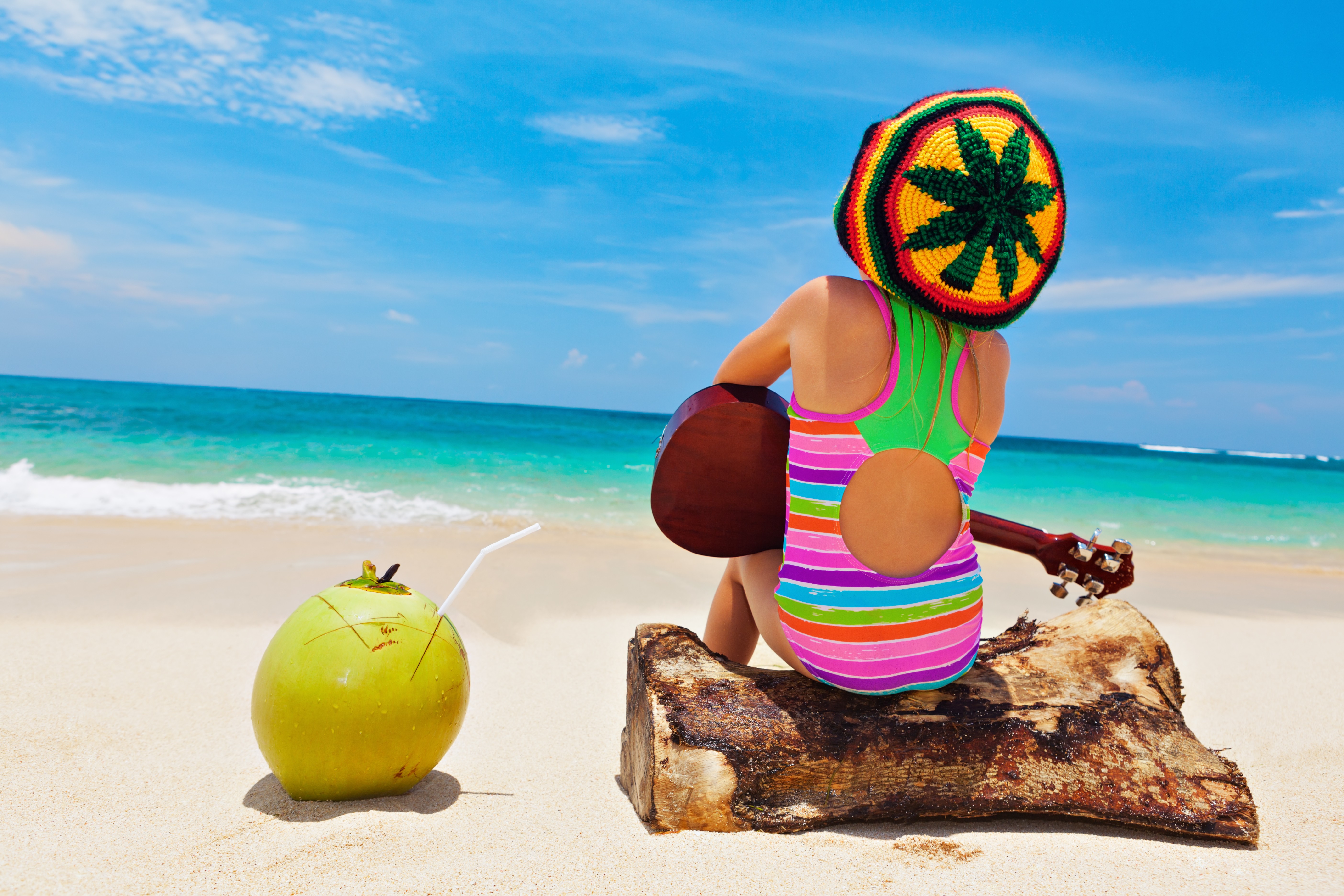 Child on beach with rasta hat Jamaica